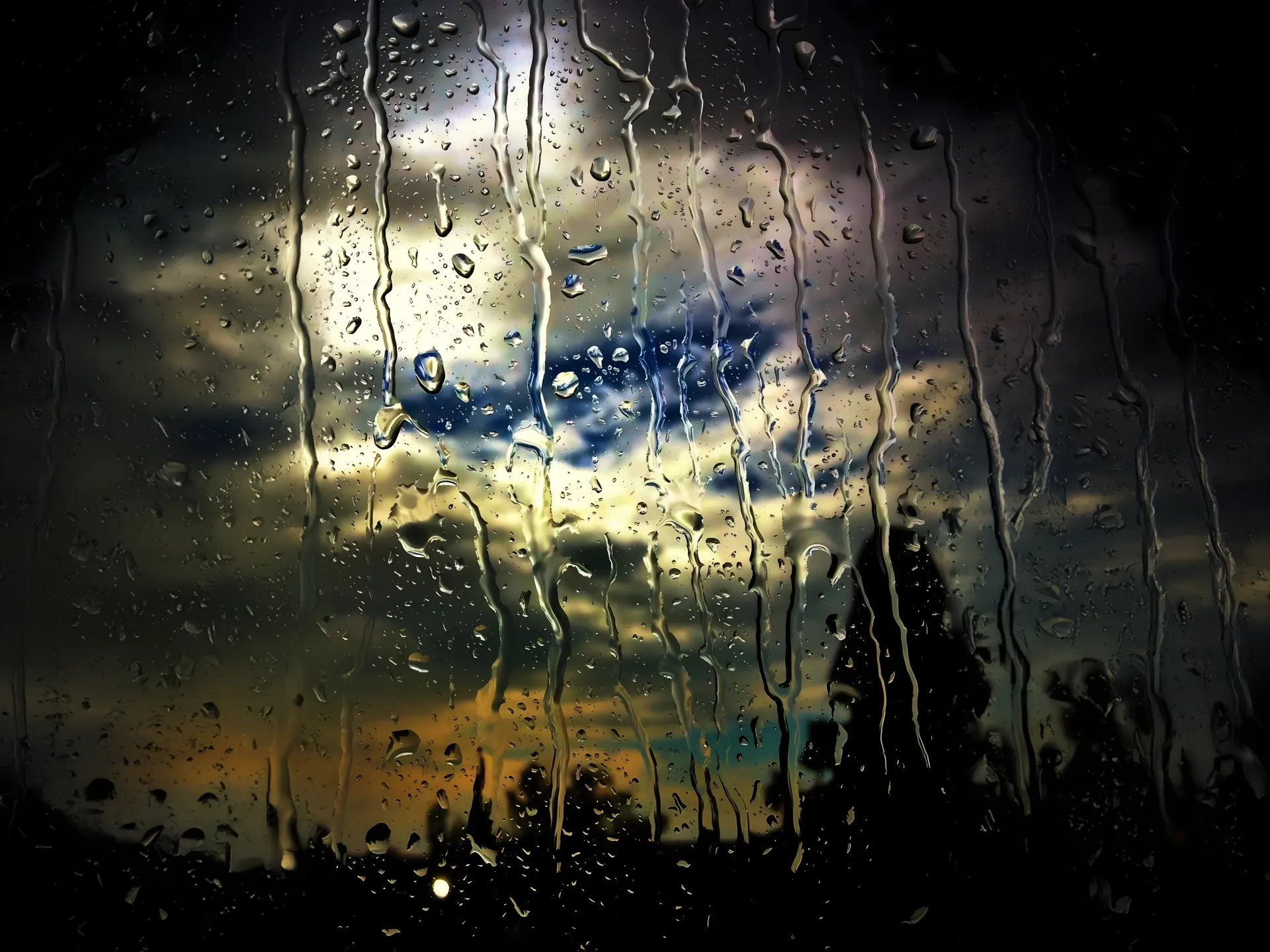 Rainy Window Golden Storm Clouds Wallpaper