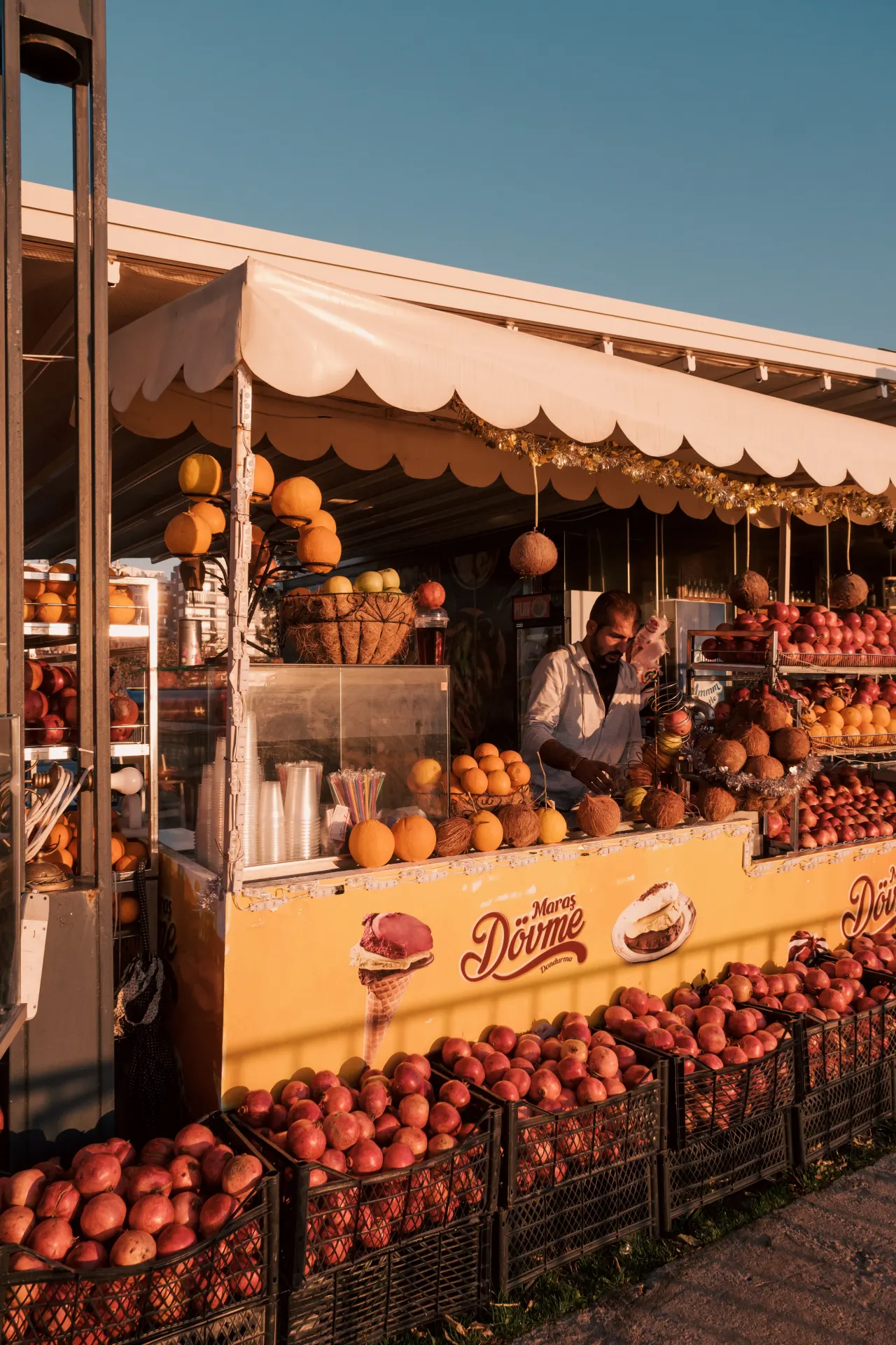 Colorful Outdoor Fruit Market at Sunset Wallpaper