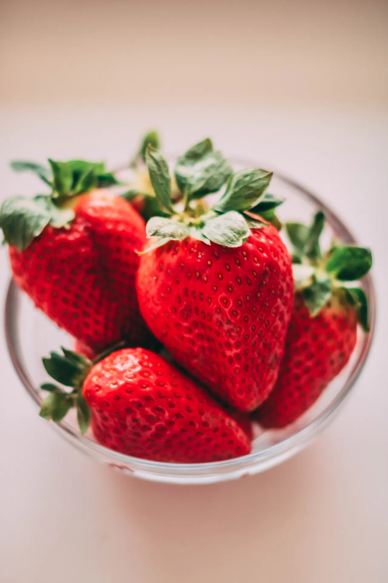 Fresh Red Strawberries in Glass Bowl Wallpaper