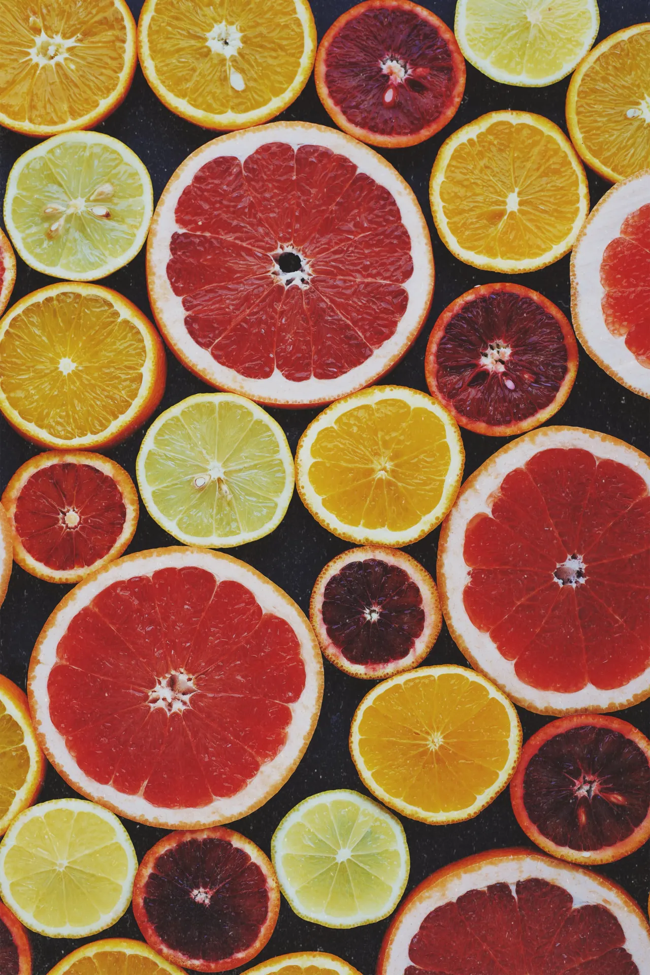 Colorful Orange Grapefruit and Lemon Slices Wallpaper
