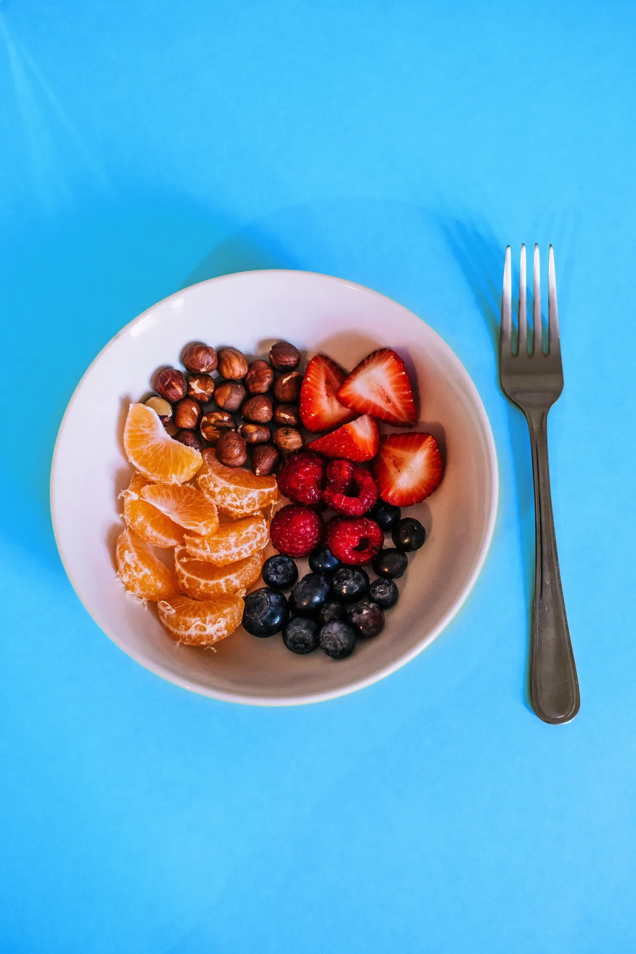 Fresh Berries Citrus and Hazelnuts Bowl Wallpaper