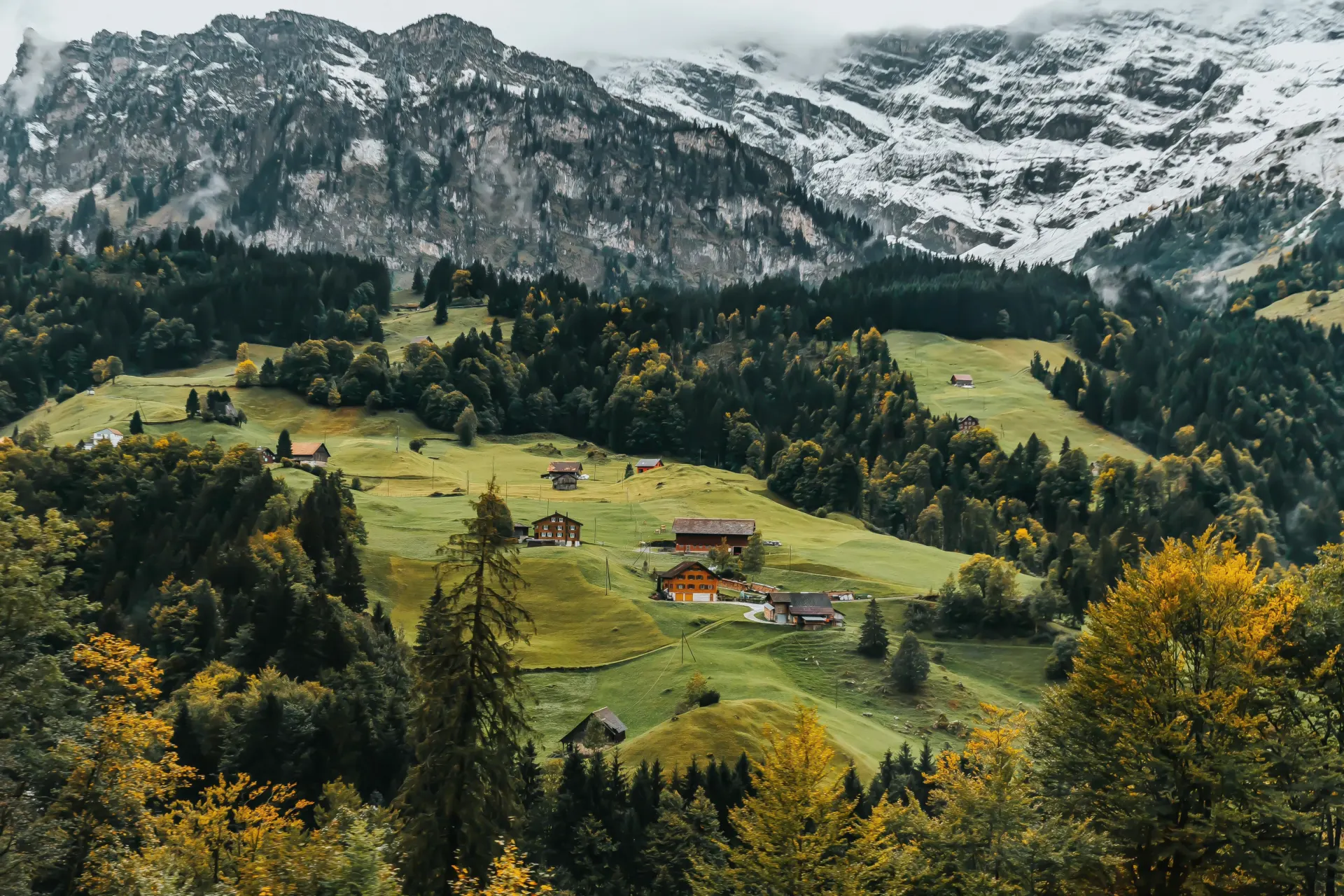 Scenic Alpine Village and Snowy Mountain Landscape Wallpaper