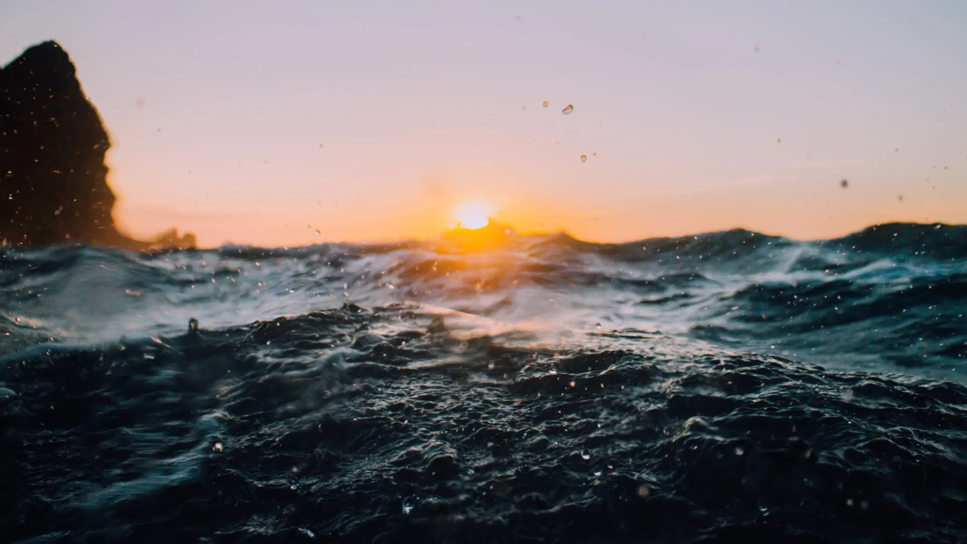 Ocean Waves and Glowing Sunset Wallpaper